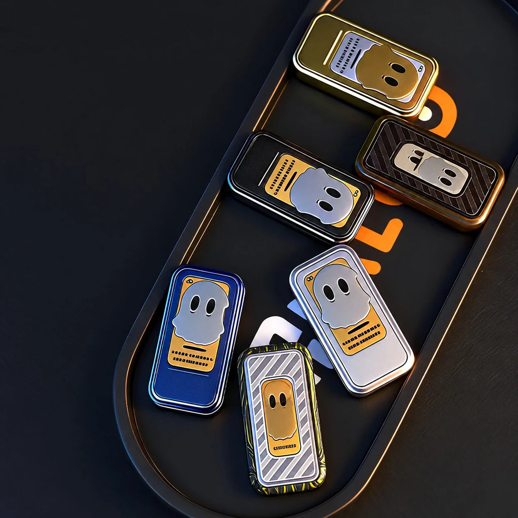 THE GHOST fidget slider — colourways laid out in a display tray