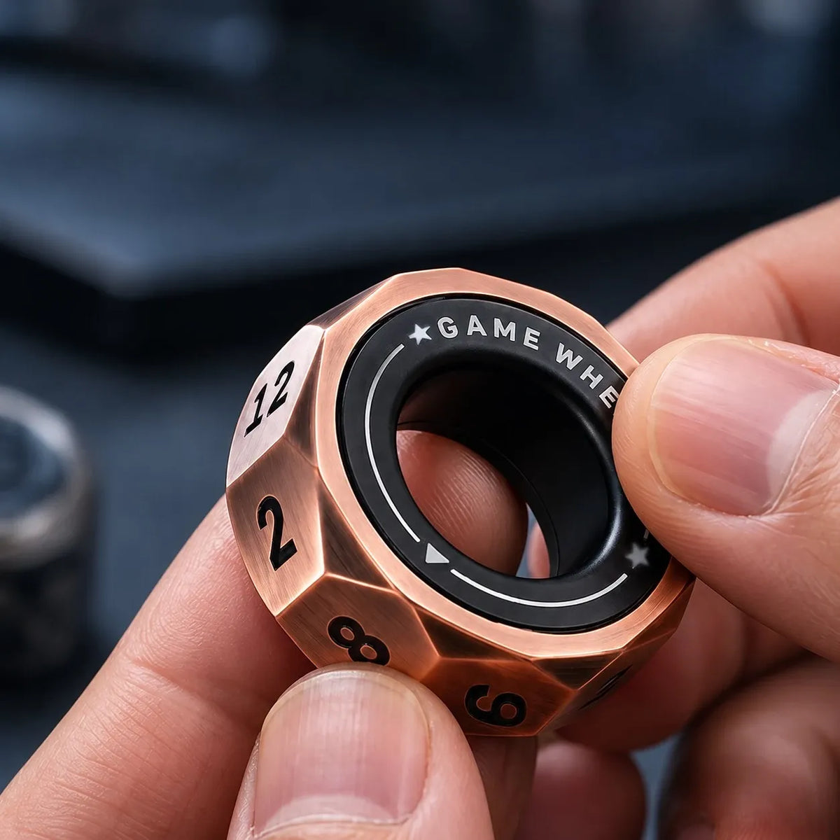 D12 magnetic decision ring in hand, numbered bronze facets