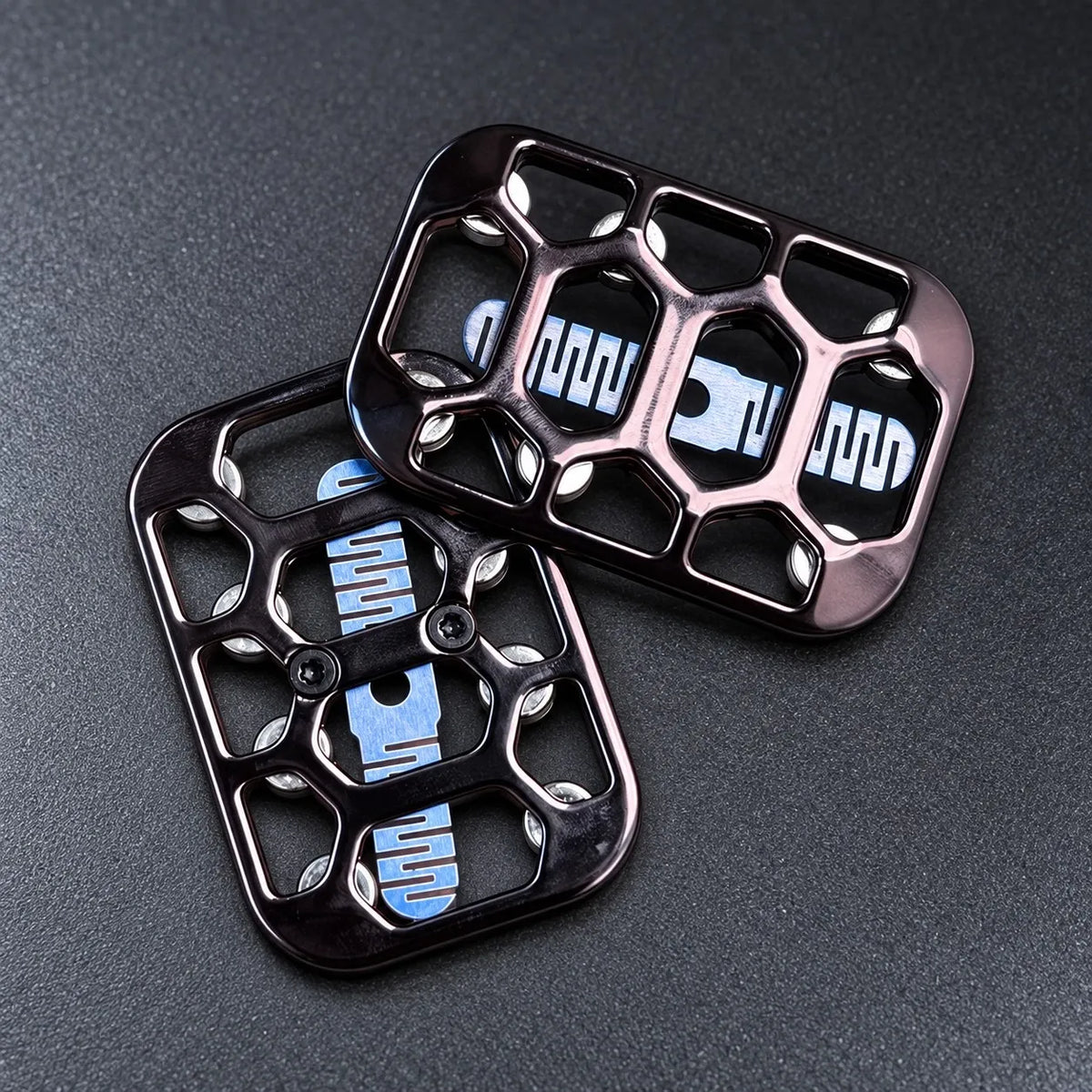 Black magnetic fidget slider, two plates stacked, hollow frame and blue slider