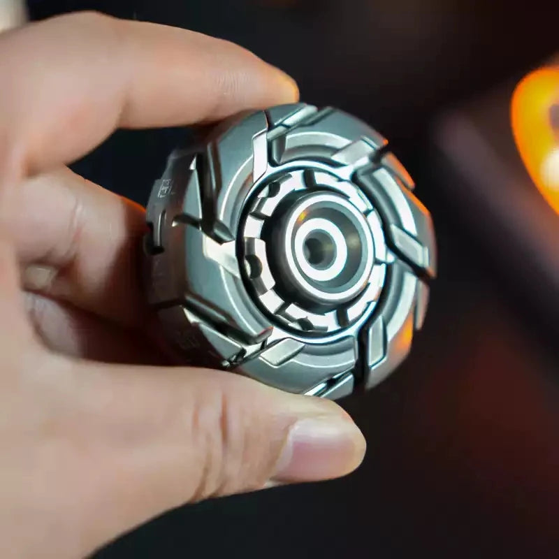 MECHA fidget spinner held in hand, front view