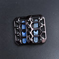 Black and gunmetal magnetic fidget sliders on a bead-blasted steel desk