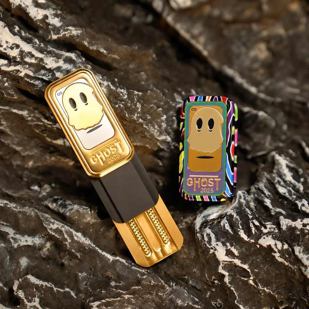 Two THE GHOST fidget sliders on a dark stone surface