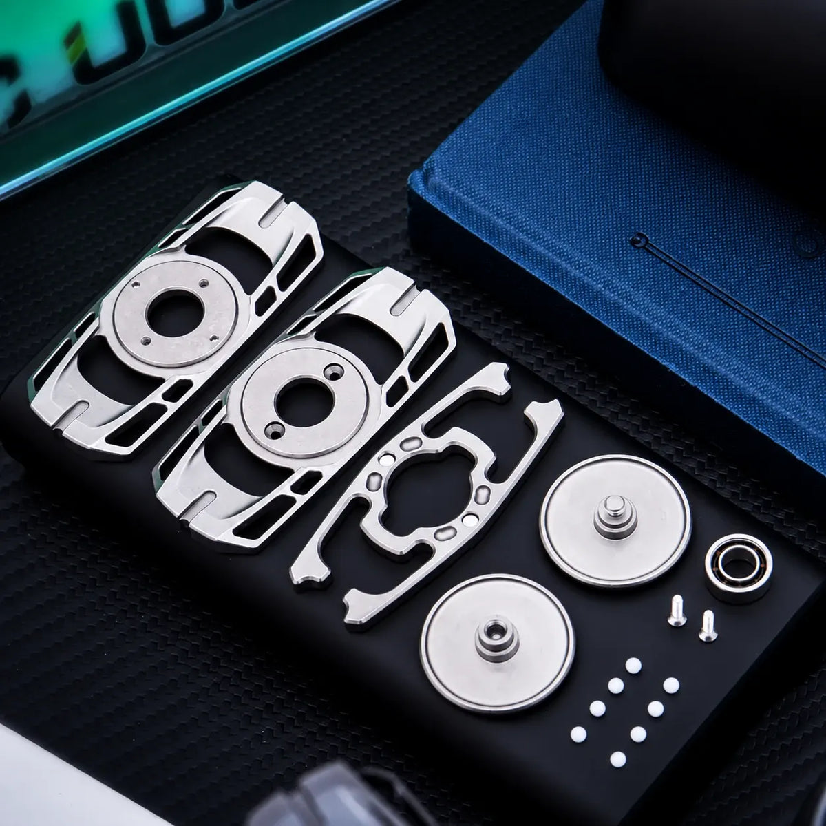 ToneSpin fidget spinner disassembled, showing parts and spares